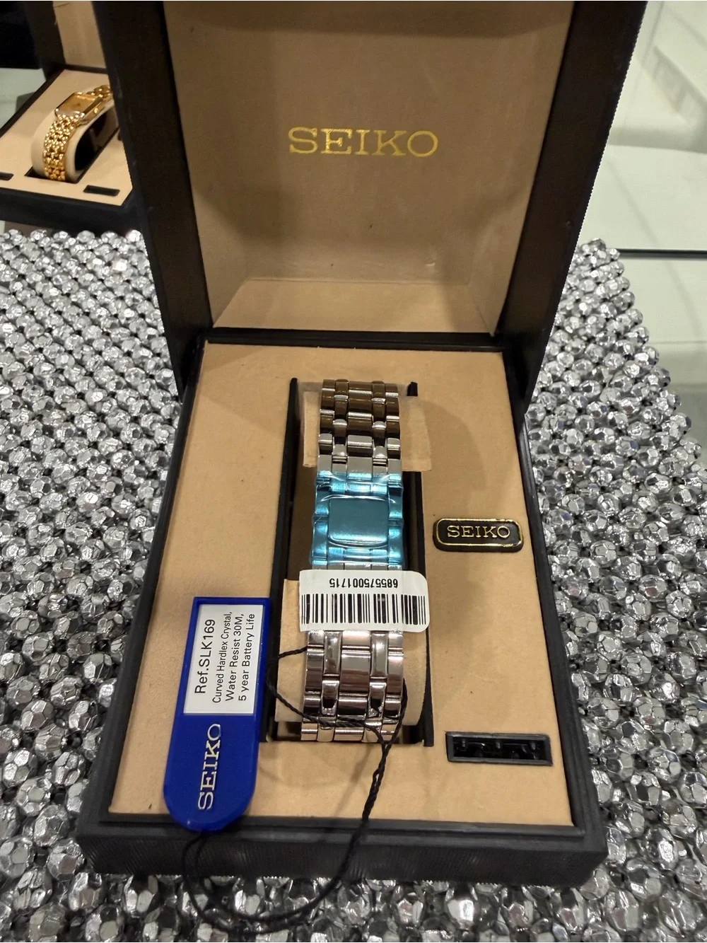 Seiko Silver Watch with Gold Accents and Rectangular Dial
